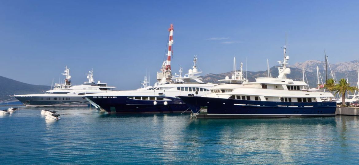 superyachts lined up in a harbor