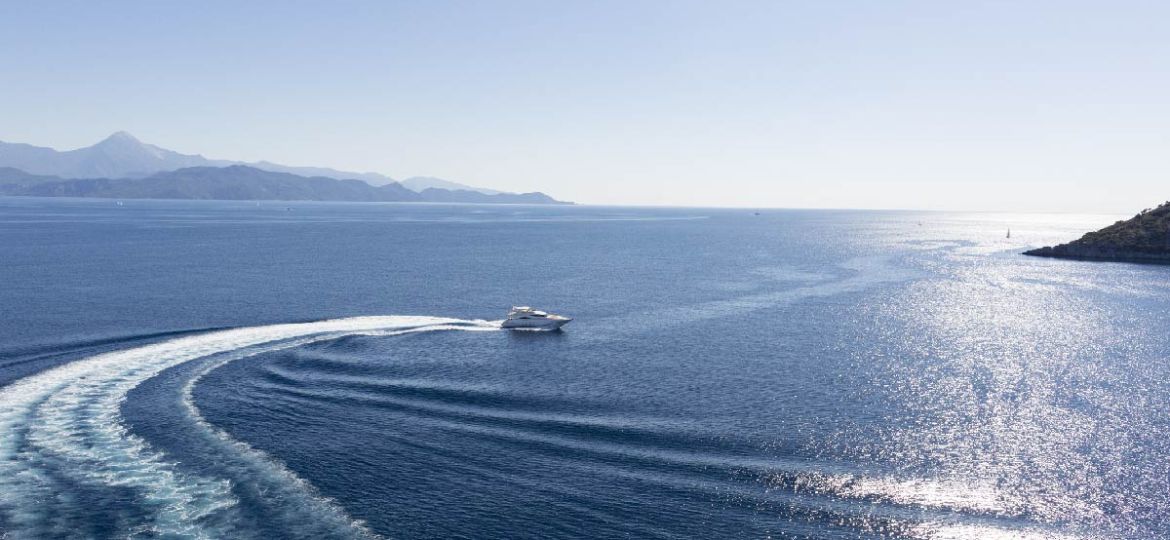 a superyacht charter cruising in open blue water